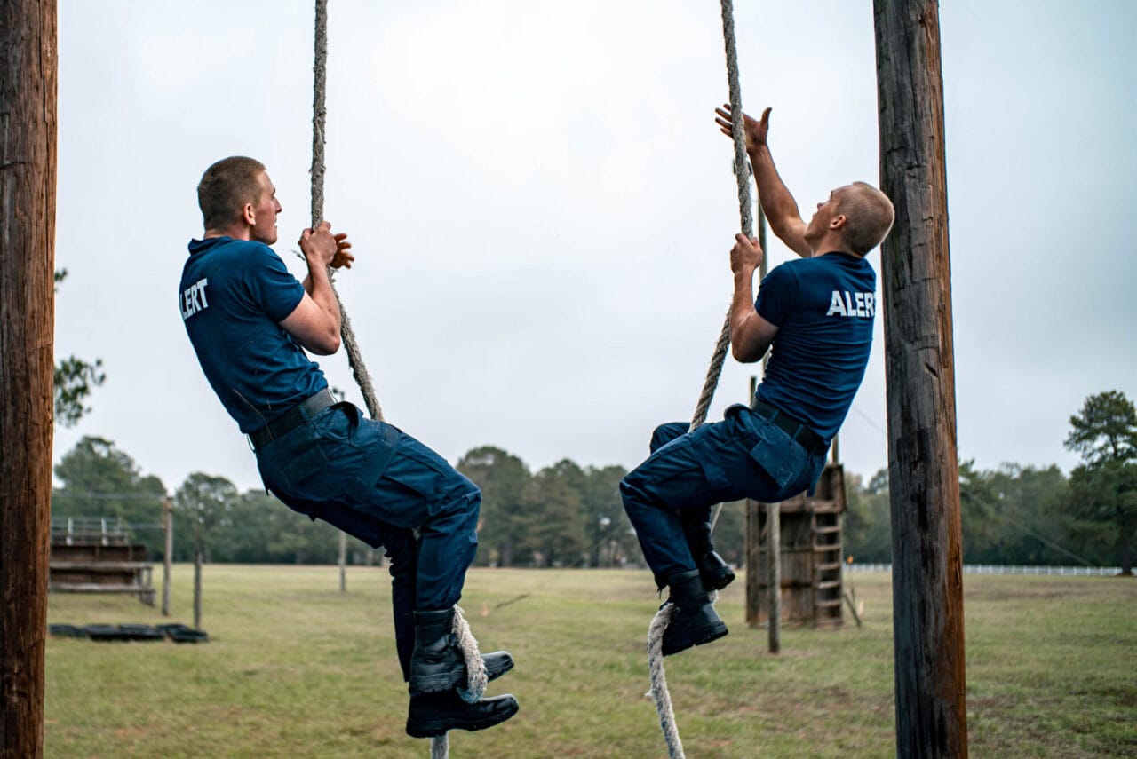 Recruits climbing ropes at Basic Training